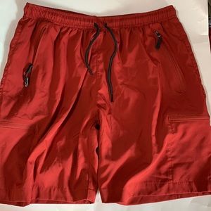 SANTINY men’s light weight cargo shorts rust orange in color size L